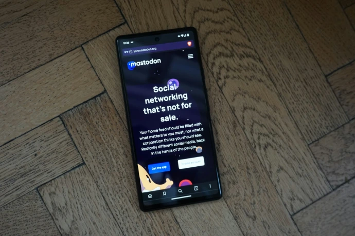 a cell phone sitting on top of a wooden floor